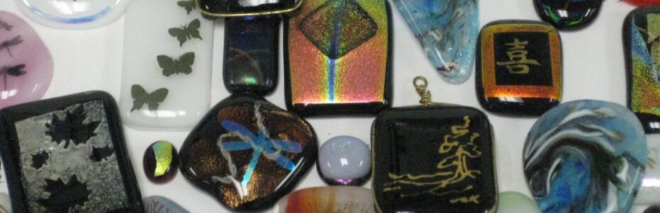 Assorted decorative glass stones with various colors and designs.