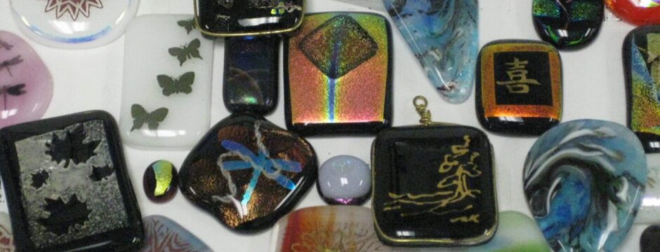Assorted decorative glass stones with various colors and designs.