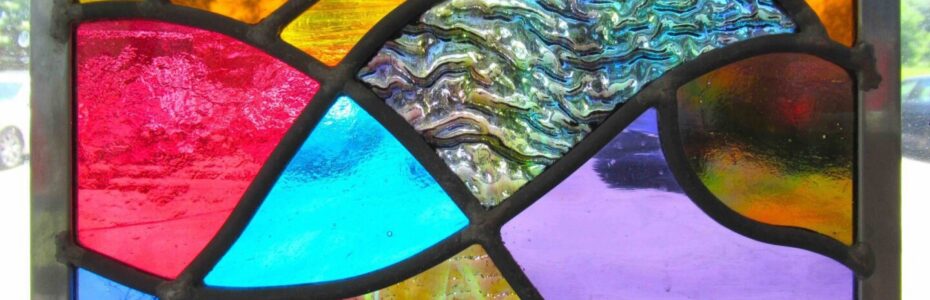 Abstract stained glass with vibrant colors.