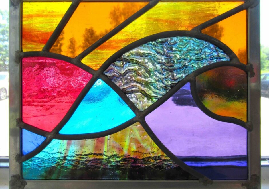 Abstract stained glass with vibrant colors.