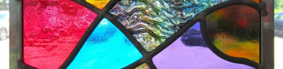 Abstract stained glass with vibrant colors.