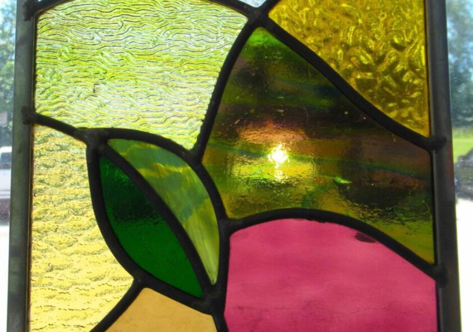 Colorful abstract stained glass window design.