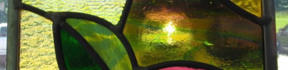 Colorful abstract stained glass window design.