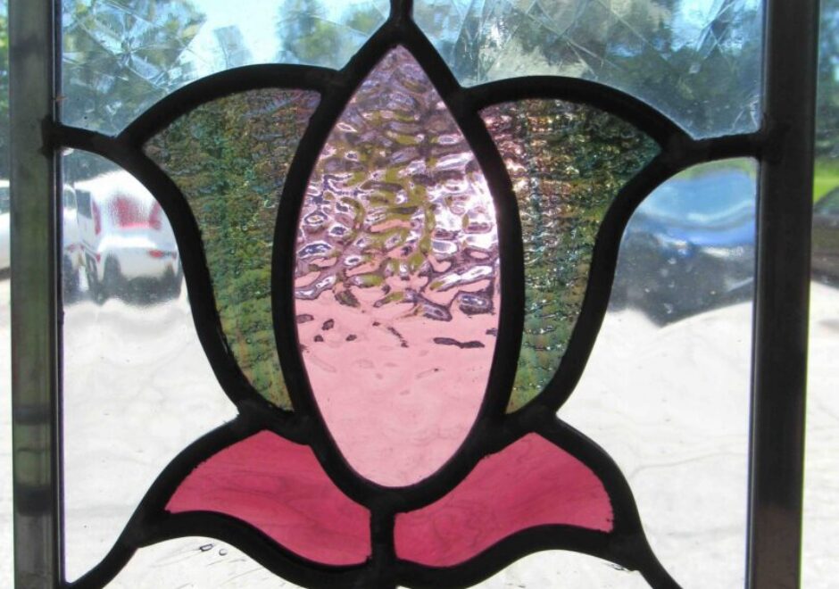 Stained glass window with floral design.