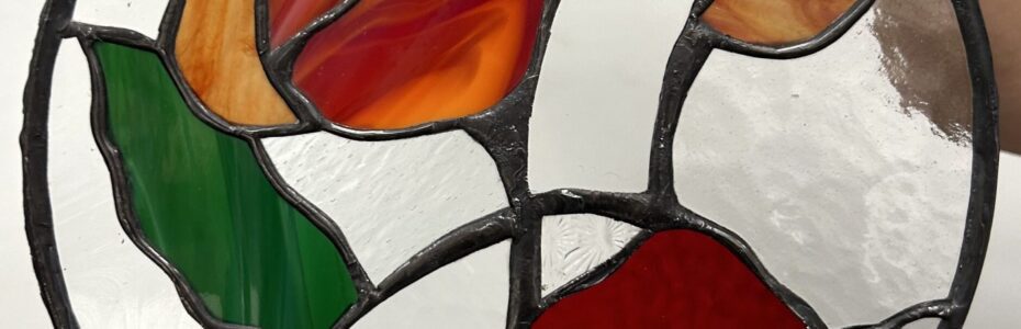 Stained glass with colorful floral design.