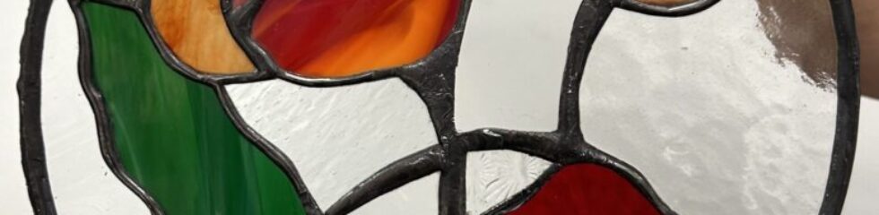 Stained glass with colorful floral design.